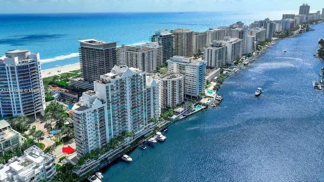 drone / aerial view featuring a water view and a city view