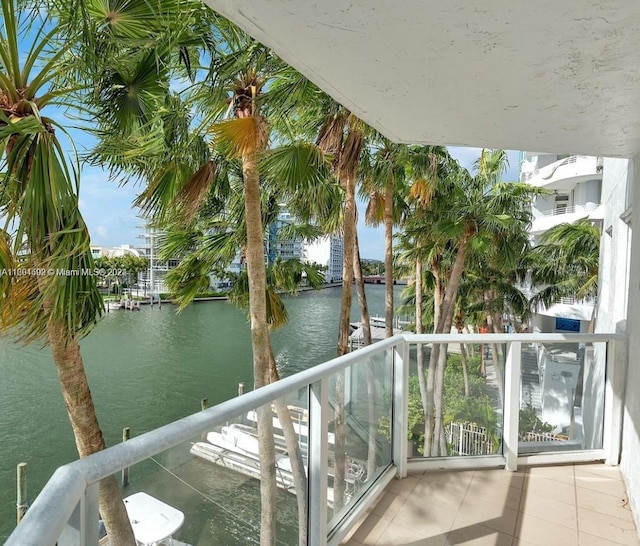 balcony featuring a water view