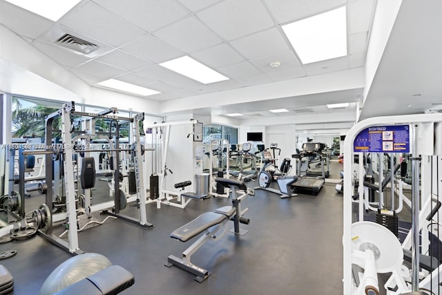 exercise room with a drop ceiling