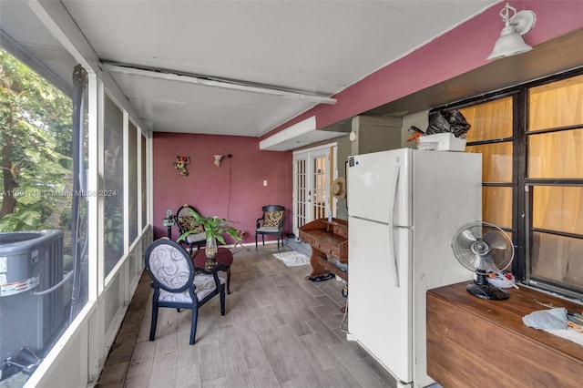 kitchen with french doors, white fridge, and light wood-type flooring