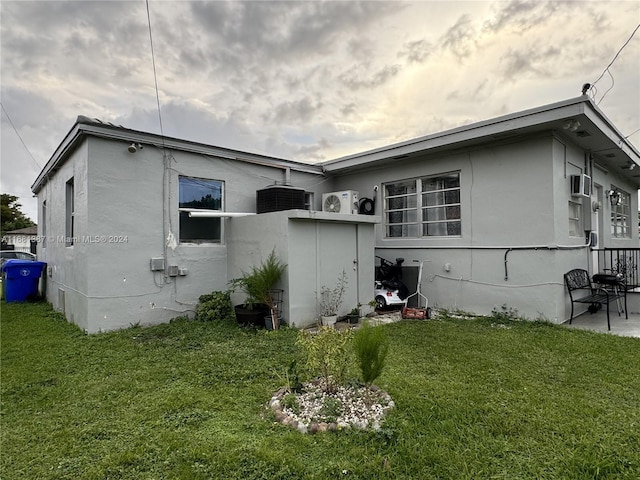 view of home's exterior with a lawn