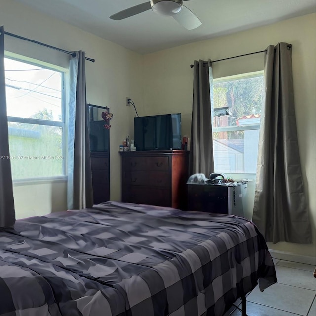 bedroom featuring ceiling fan and light tile patterned floors