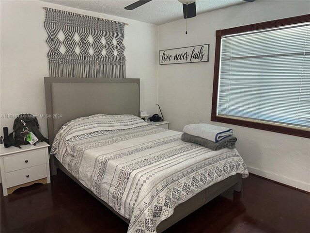 bedroom featuring a textured ceiling and ceiling fan