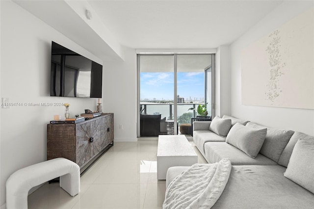 living room with expansive windows and light tile patterned floors