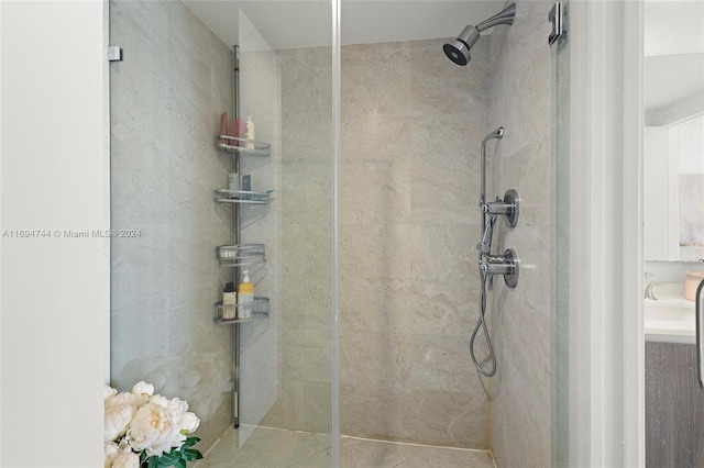 bathroom with a tile shower