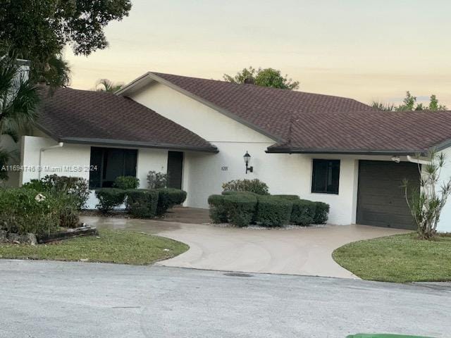 single story home featuring a garage