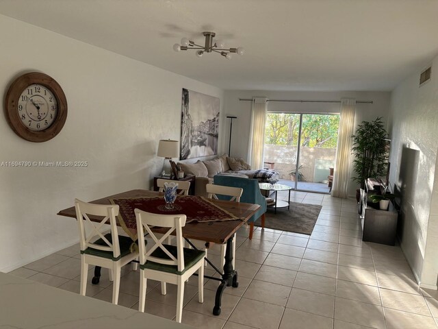 6884 N Kendall Dr Unit C407, Pinecrest, FL 33156 - dining space with light tile patterned flooring