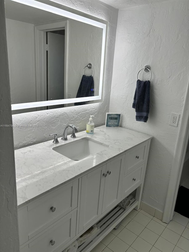 6884 N Kendall Dr Unit C407, Pinecrest, FL 33156 - bathroom featuring tile patterned flooring, vanity, and a textured wall