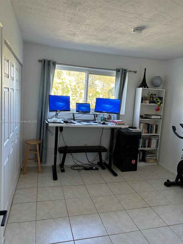 6884 N Kendall Dr Unit C407, Pinecrest, FL 33156 - office area with light tile patterned flooring and a textured ceiling