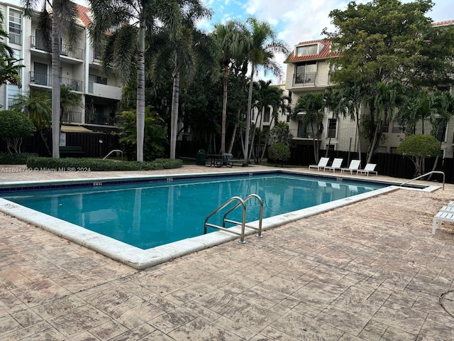 view of swimming pool featuring a patio