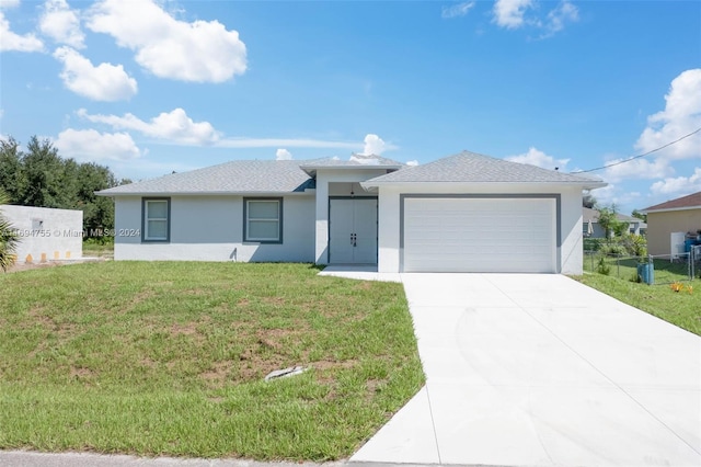 view of front of home with a garage and a front yard