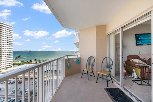 balcony featuring a water view