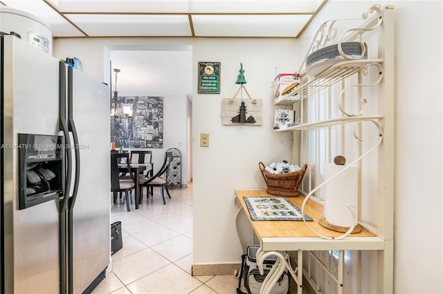 kitchen with stainless steel fridge and light tile patterned flooring