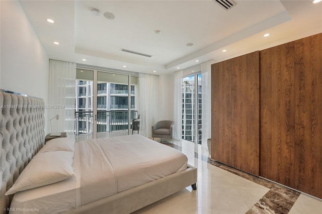 bedroom featuring a tray ceiling