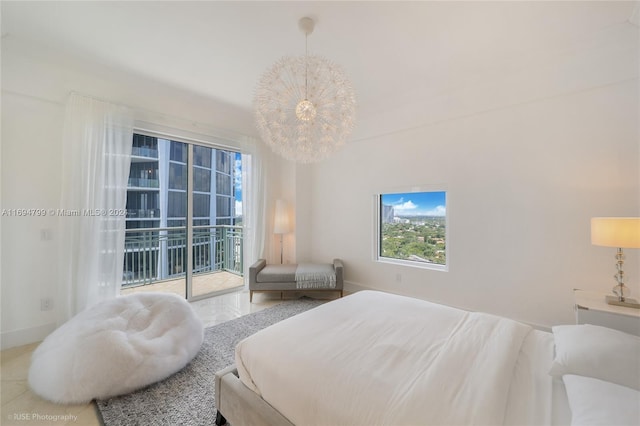 bedroom with access to outside and a notable chandelier