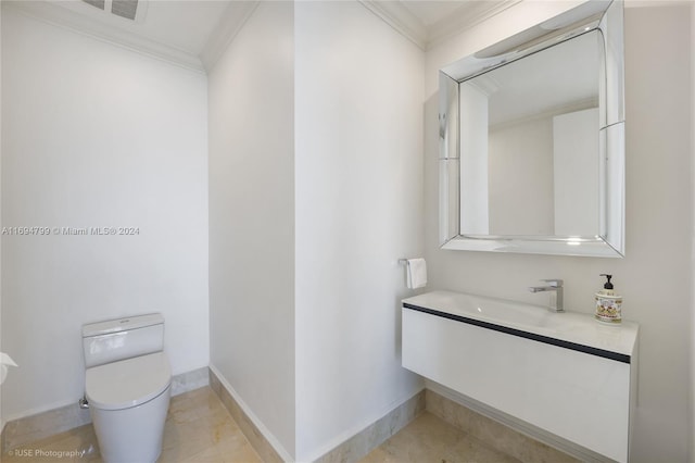 bathroom featuring vanity, toilet, and crown molding