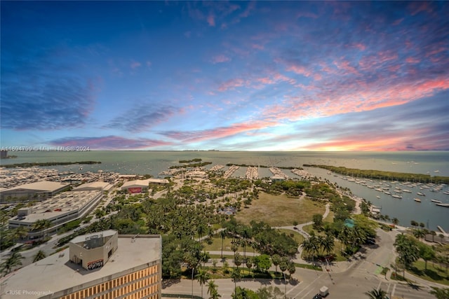 aerial view at dusk with a water view