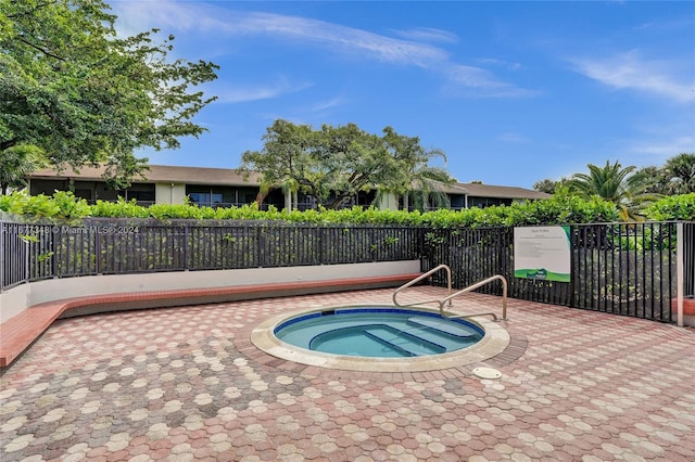 view of pool featuring a hot tub