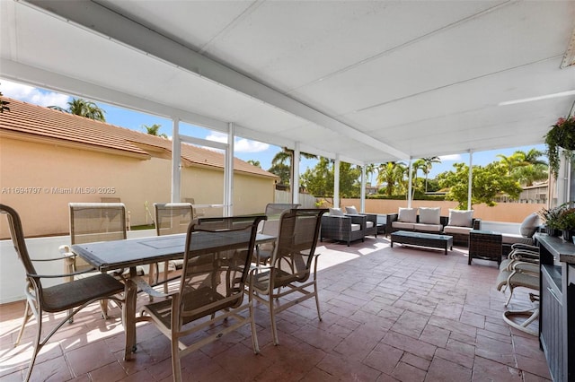 view of patio / terrace featuring outdoor dining space, outdoor lounge area, and fence