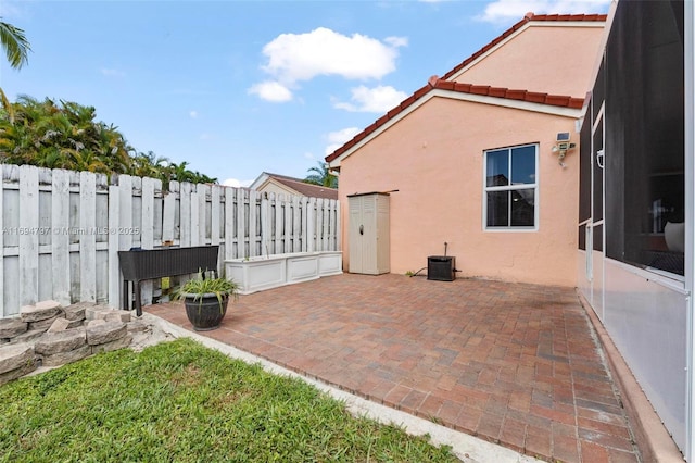 view of patio featuring central AC and fence