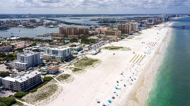 birds eye view of property featuring a view of the beach and a water view