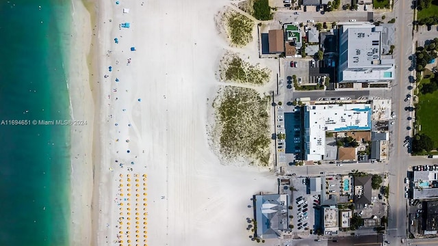 aerial view with a view of the beach and a water view