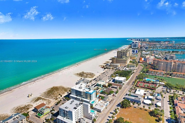 drone / aerial view featuring a view of the beach and a water view