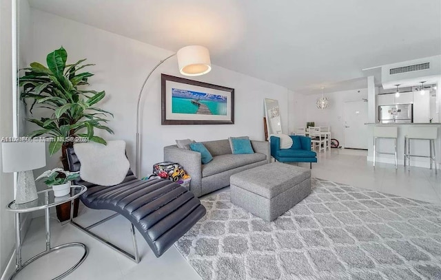 living room featuring a notable chandelier