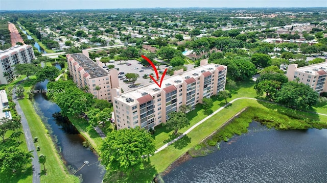 birds eye view of property with a water view