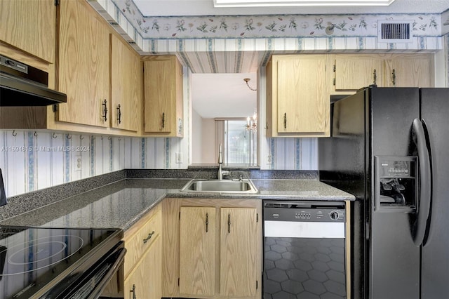 kitchen with black appliances, ventilation hood, sink, light brown cabinetry, and a chandelier