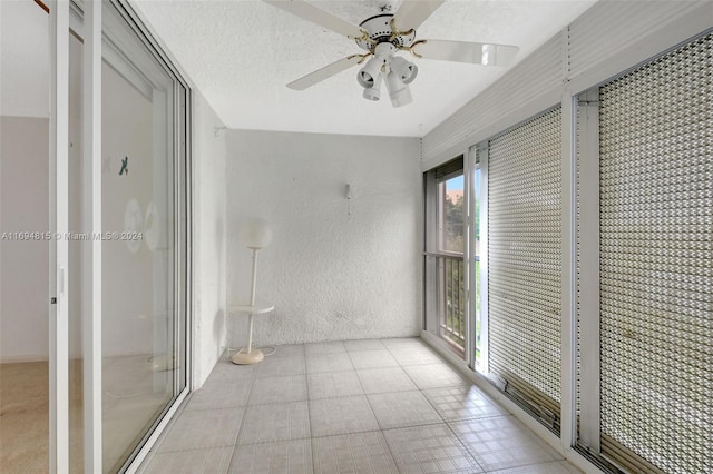 interior space with ceiling fan and plenty of natural light