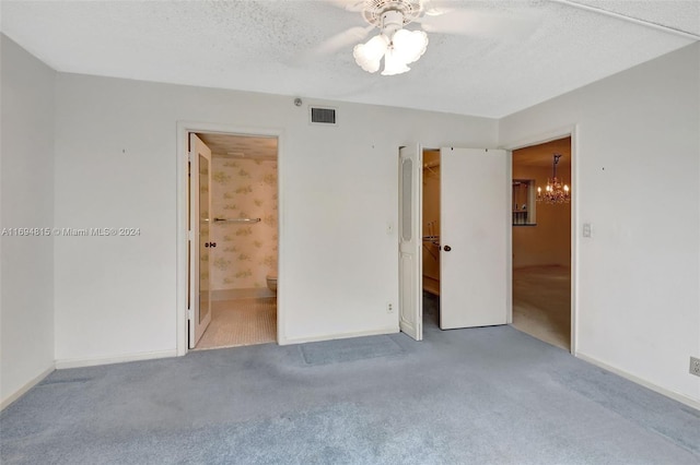 unfurnished room featuring light carpet, a textured ceiling, and ceiling fan