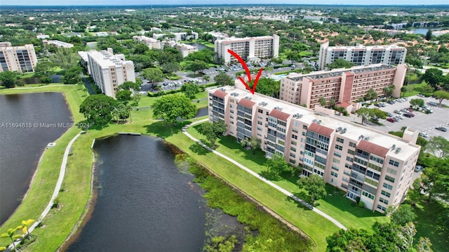 birds eye view of property with a water view