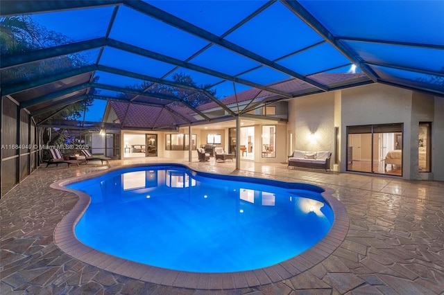 view of swimming pool with a lanai, a patio, and an outdoor hangout area