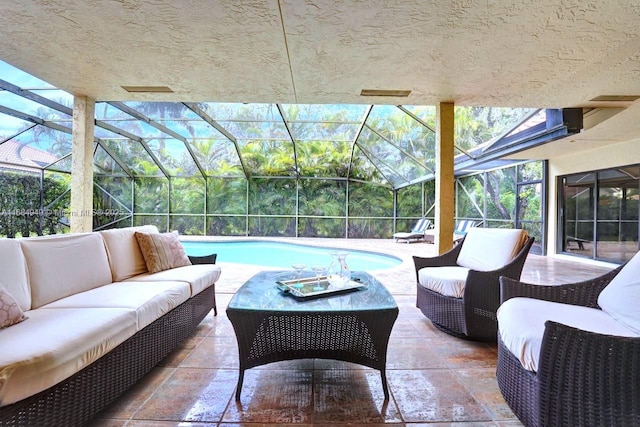 view of patio featuring an outdoor living space and glass enclosure