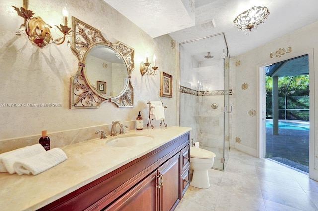 bathroom with walk in shower, vanity, and toilet