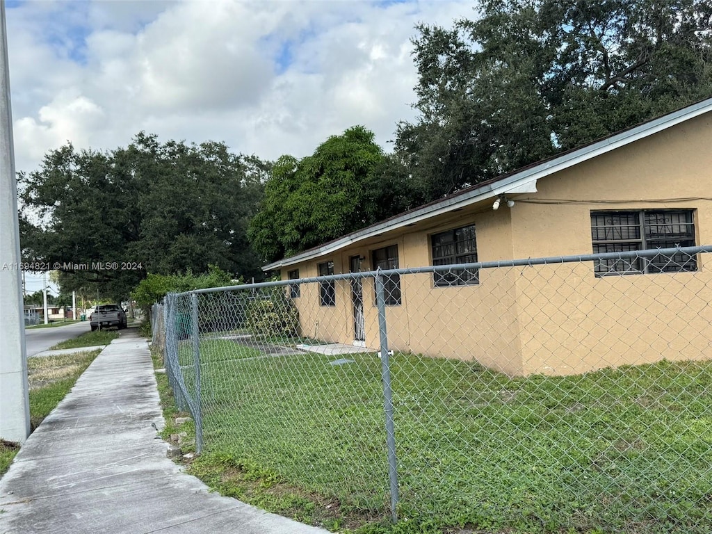 view of property exterior featuring a yard