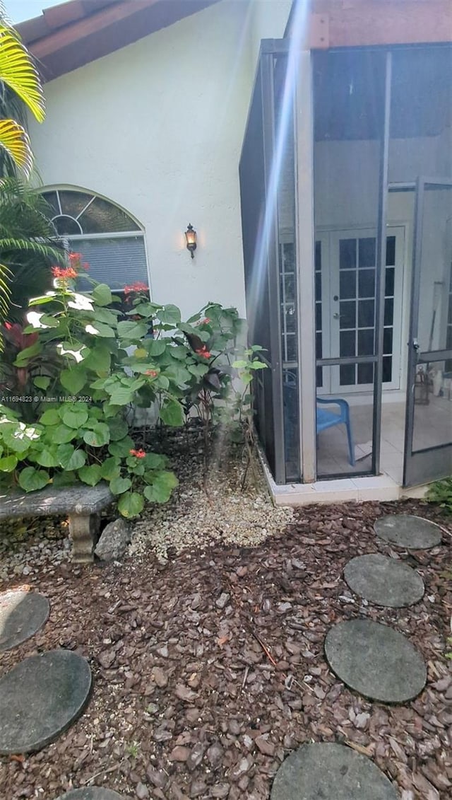 view of home's exterior featuring french doors