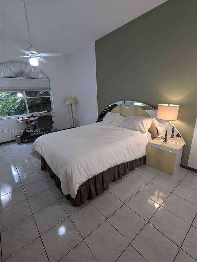 bedroom featuring ceiling fan and light tile patterned flooring