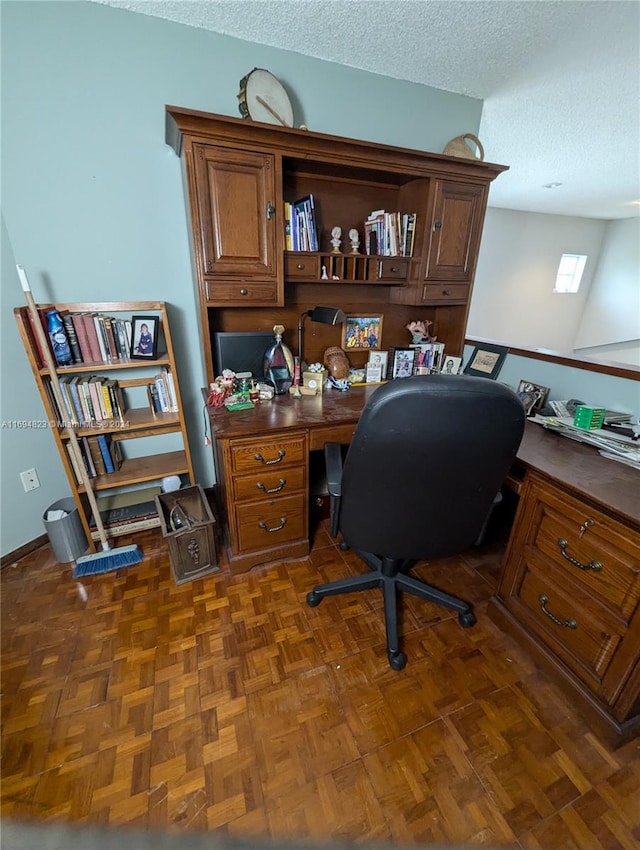 home office with dark parquet floors and a textured ceiling