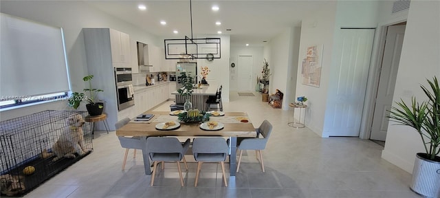 dining area with light tile patterned flooring