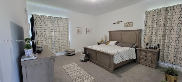 bedroom with light colored carpet