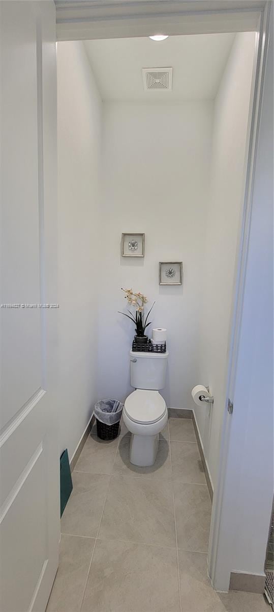 bathroom with tile patterned floors and toilet