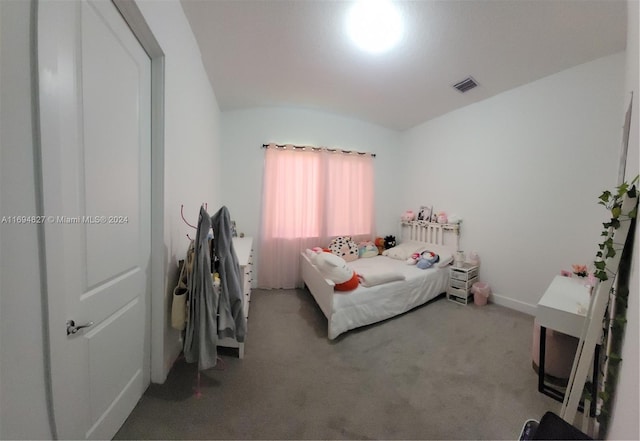 carpeted bedroom featuring vaulted ceiling