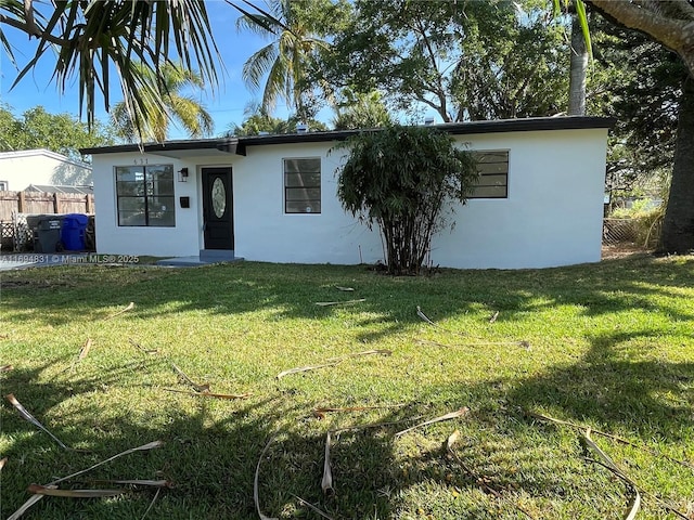 single story home with a front yard