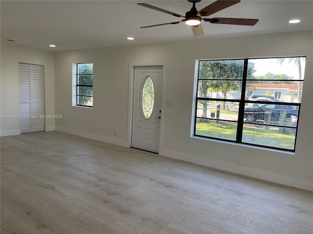 entryway with light hardwood / wood-style floors and ceiling fan