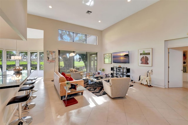 tiled living room with a high ceiling