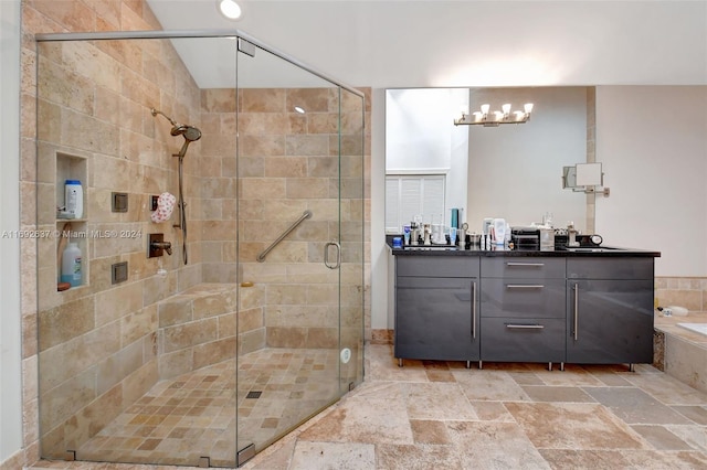 bathroom with vanity and a shower with door