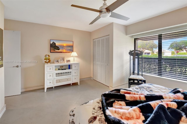 bedroom featuring ceiling fan and a closet