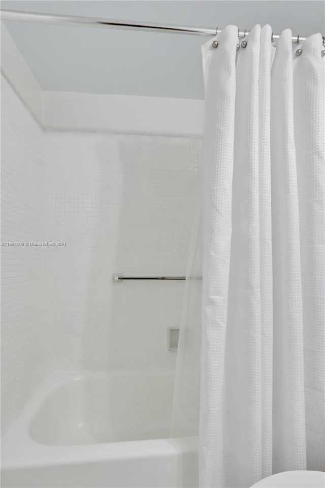 4107 E Cambridge E Unit 4107, Deerfield Beach, FL 33442 - full bath with shower / bath combo with shower curtain